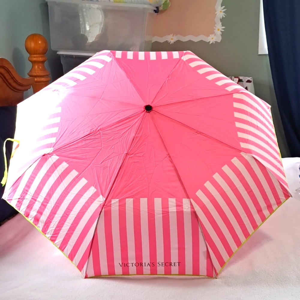 Victoria's Secret pink stripe lime green trim fold up carry umbrella.